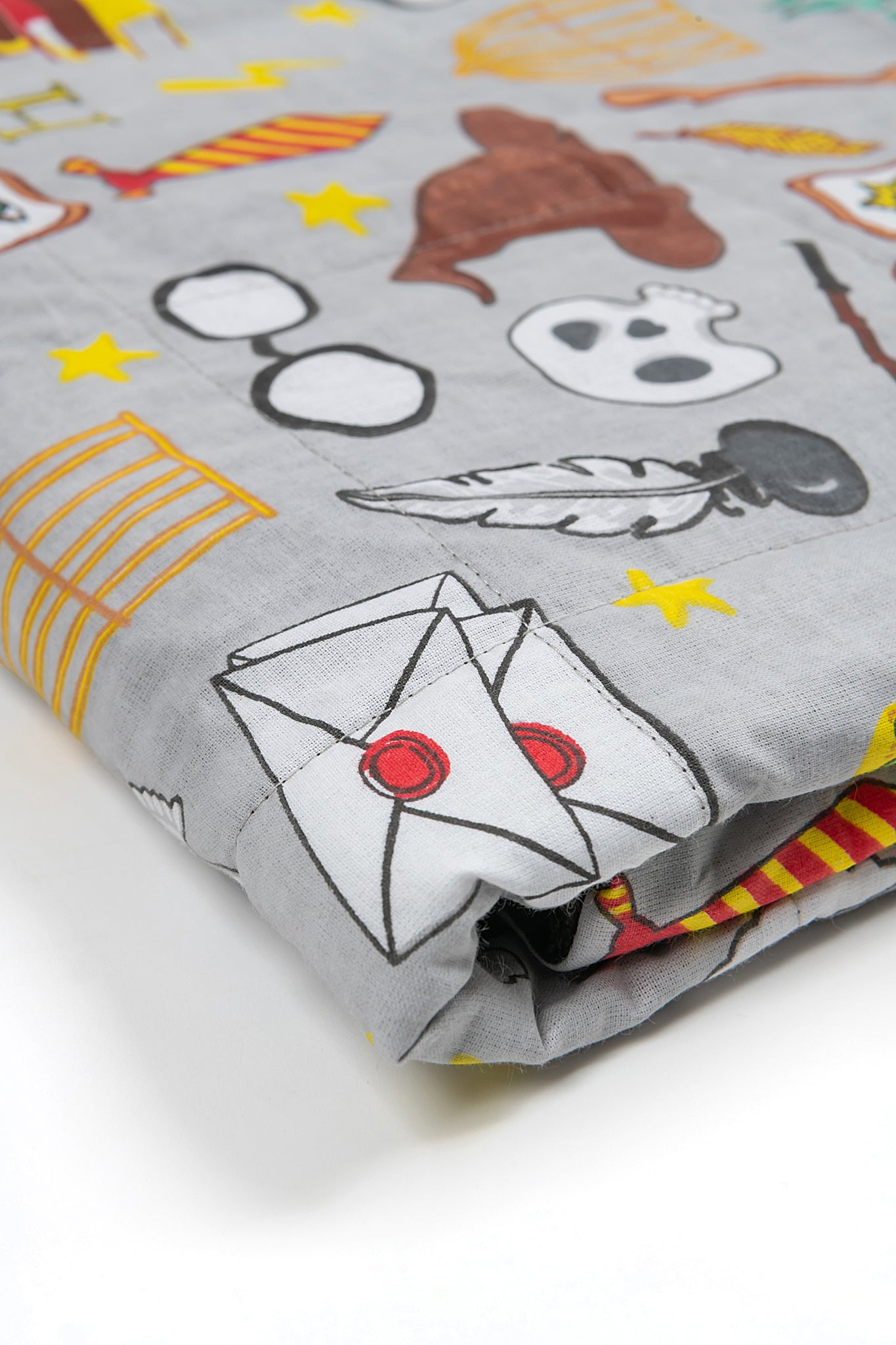 folded weighted blanket with harry potter style print