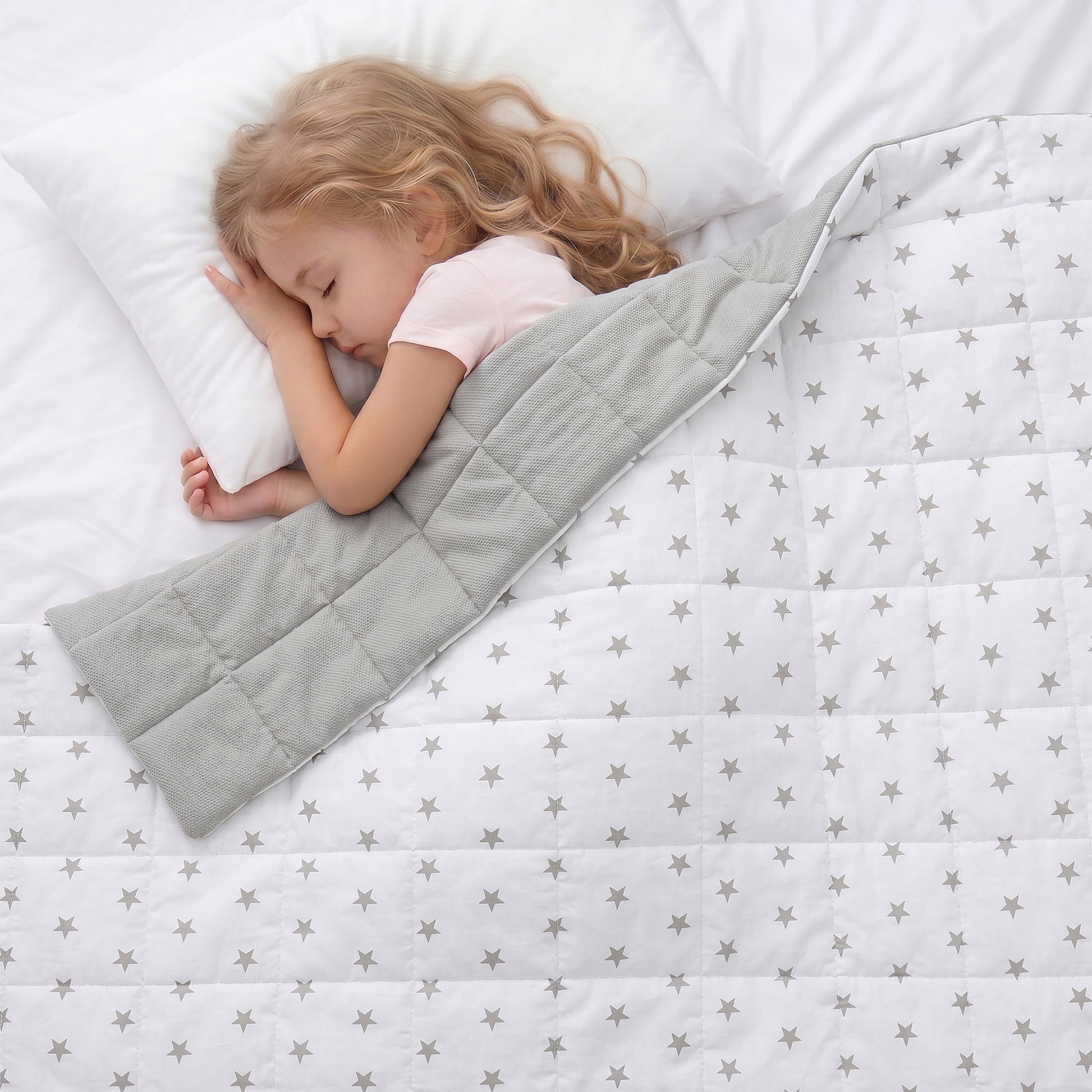 girl sleeping under the grey stars weighted blanket