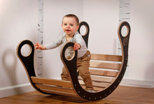 Cargar imagen en el visor de la galería, A child playing in good wood rocker colour black