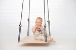 toddler sitting on SENSORY PLATFORM- GOOD WOOD 